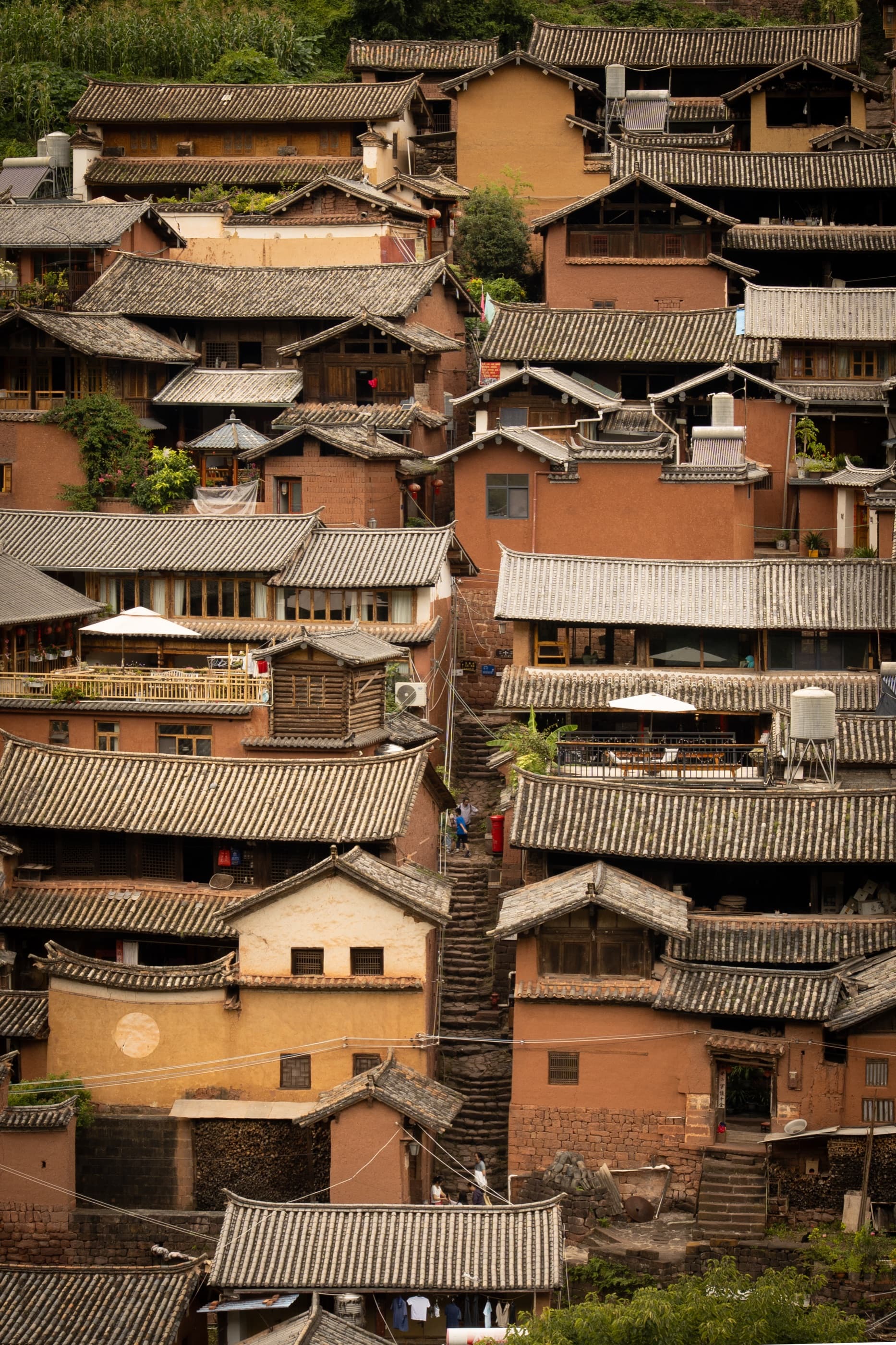 Layered village roofs on a hillside in Dali